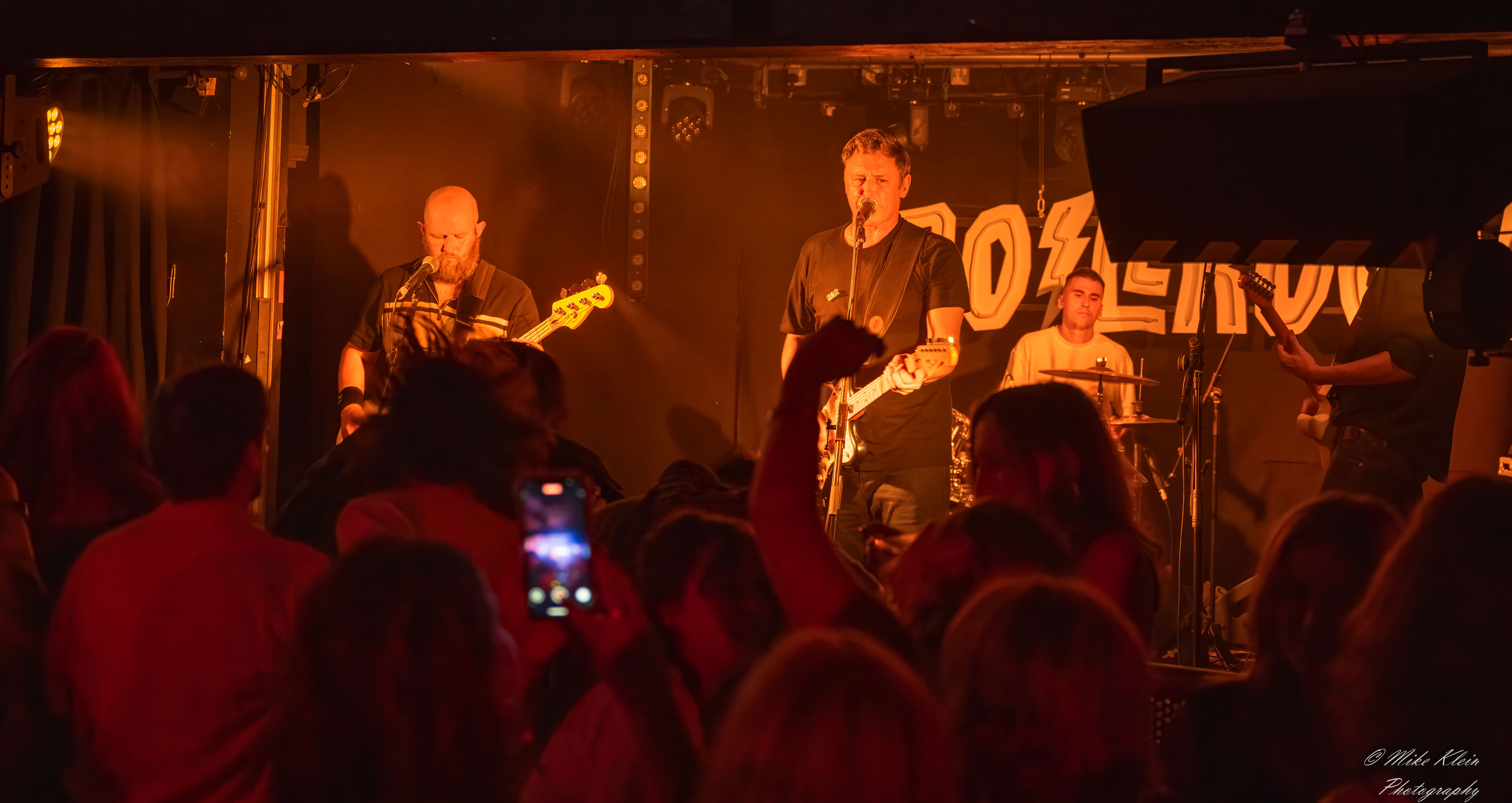 The Passengers indie rock cover band performing to packed venue audience UK festival